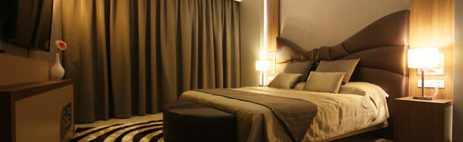 Titanic Hotel & Spa Sulaymaniyah Exterior foto A bedroom with curtains